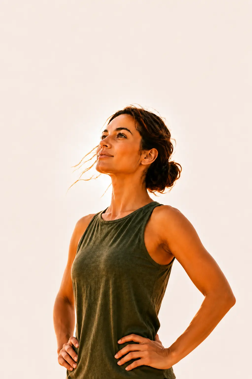 Woman in peaceful wellness moment with olive leaf shadows