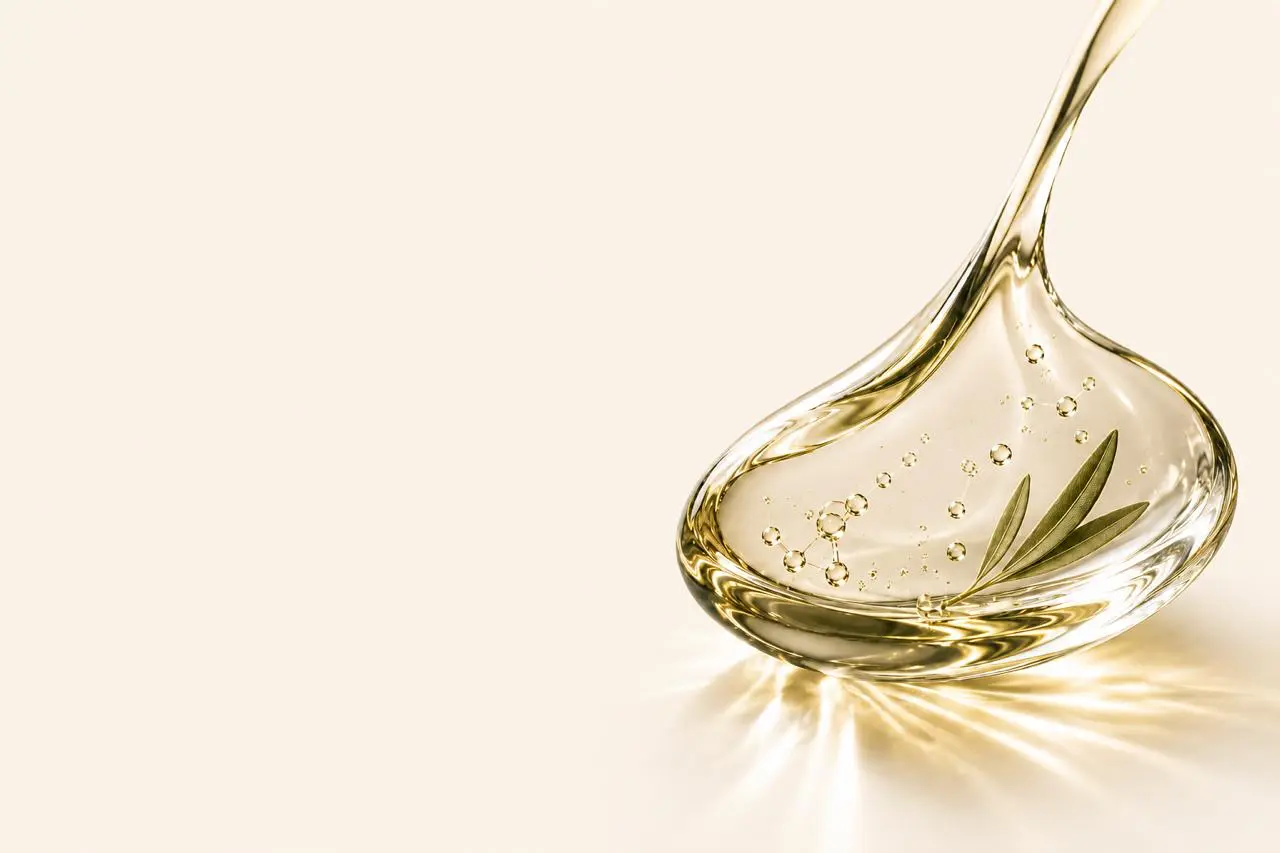 Golden olive leaf extract droplet with molecular structures