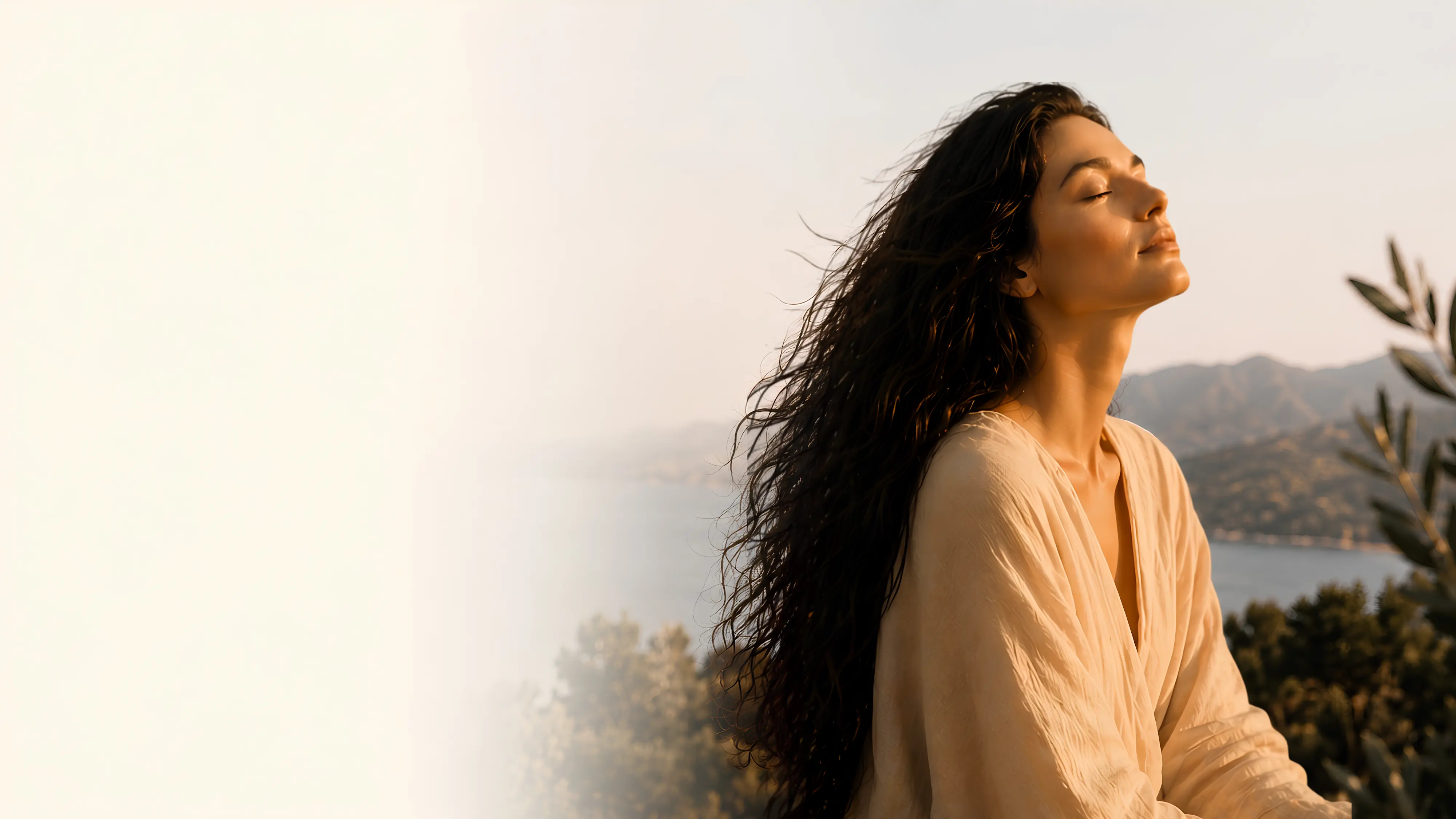 Woman enjoying Mediterranean sunshine among olive trees